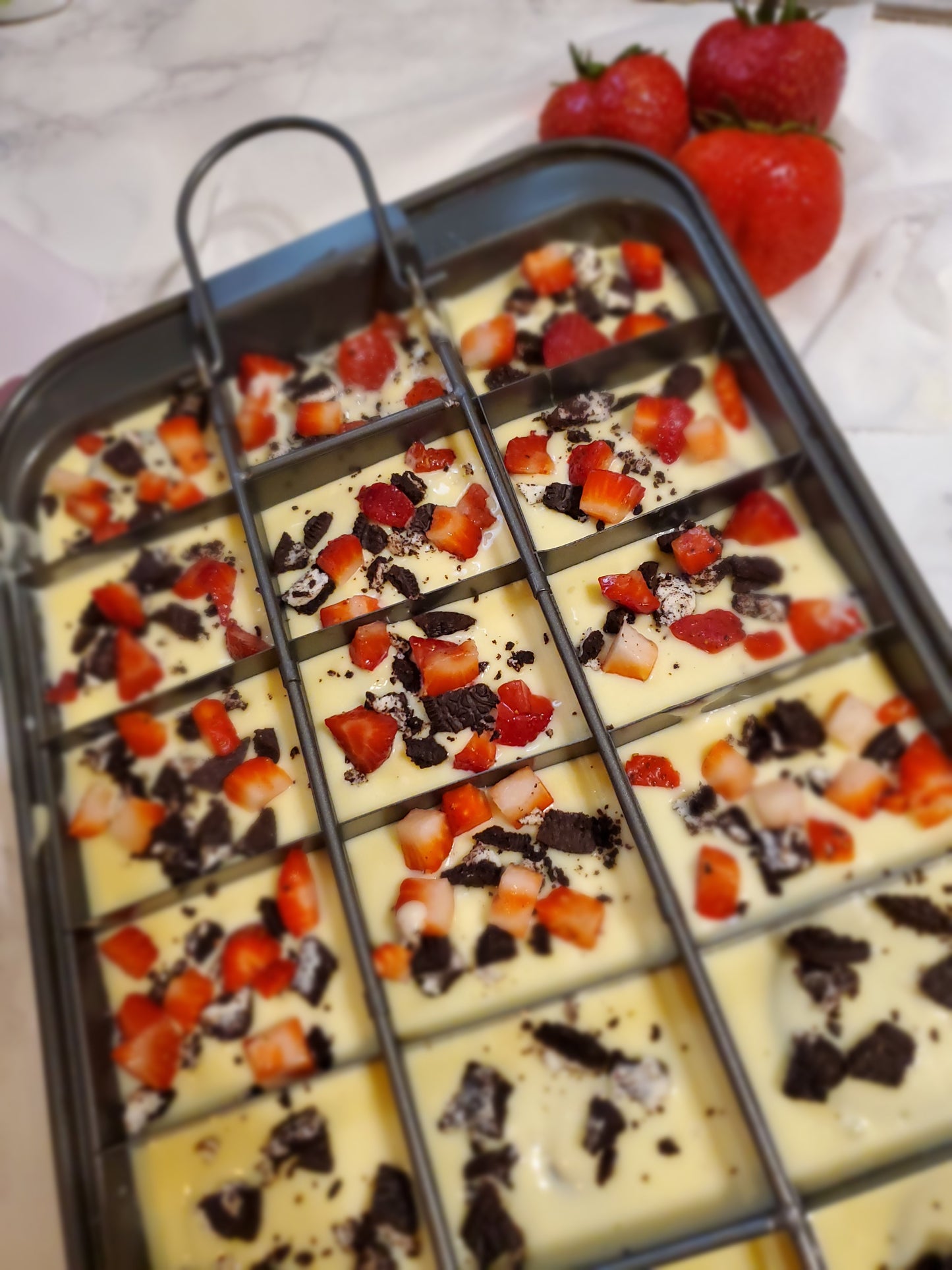 Cheesecake Brownies with OREO Cookies and Strawberries