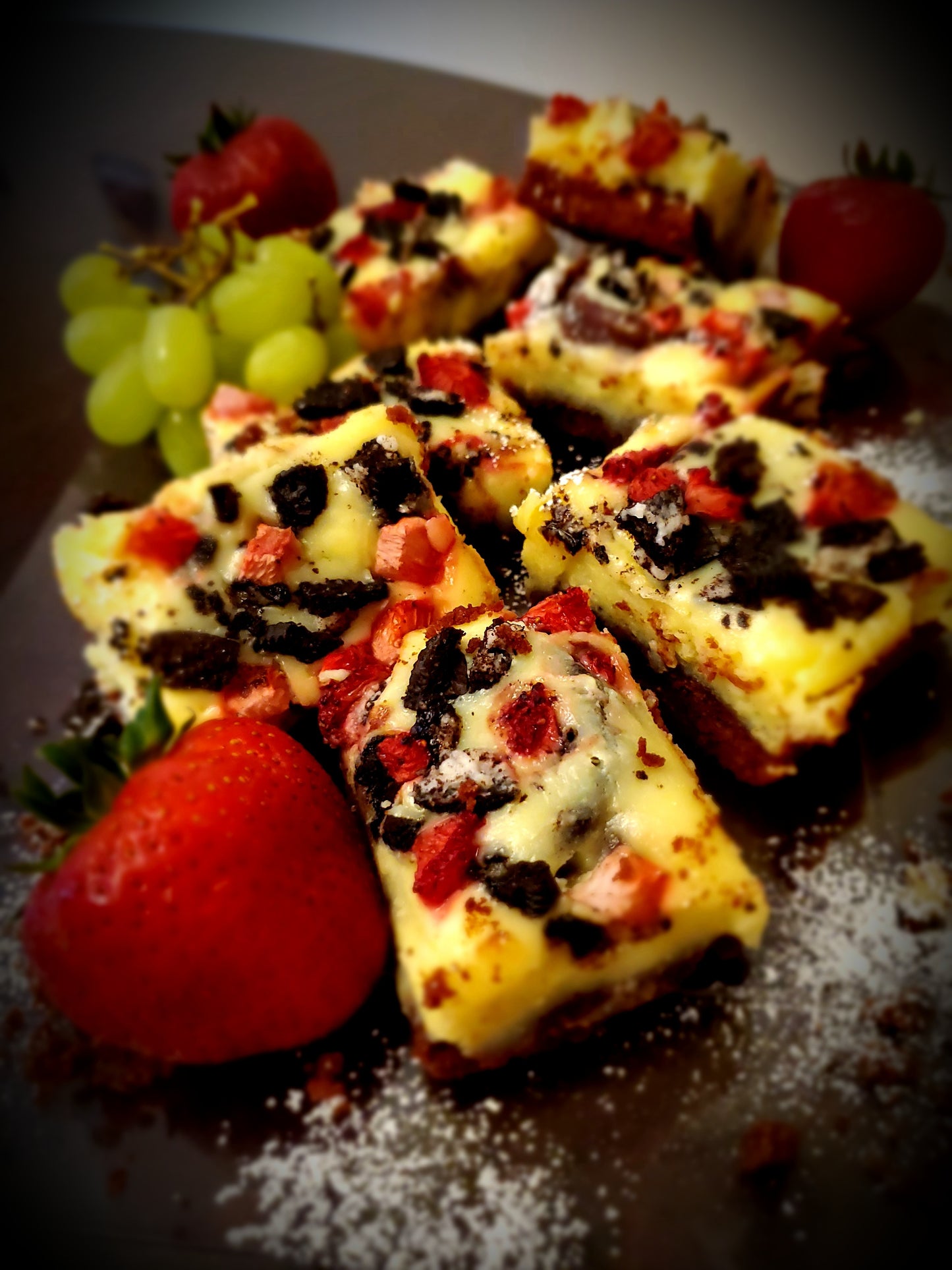 Cheesecake Brownies with OREO Cookies and Strawberries